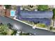 Aerial view of the condo complex, showing the community pool, boat docks, waterway, and parking areas at 2124 Tamiami N Trl # 103, Sarasota, FL 34234
