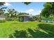 Well-maintained home with a lush backyard, pool, and ample green space at 2460 Hillview St, Sarasota, FL 34239