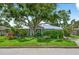 Charming one-story home with lush, mature landscaping and a metal roof at 2460 Hillview St, Sarasota, FL 34239