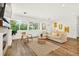 Comfortable living room with wooden floors, large window and natural light at 2460 Hillview St, Sarasota, FL 34239
