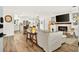 Open concept living space with modern furnishings, fireplace and island kitchen at 2460 Hillview St, Sarasota, FL 34239