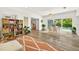 Open concept living room featuring a view of the dining room, garden, and pool at 2460 Hillview St, Sarasota, FL 34239