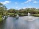 Picturesque pond with a fountain and lush greenery at 2460 Hillview St, Sarasota, FL 34239