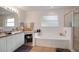 Bright bathroom with a soaking tub, walk-in shower, double sink vanity, and great natural light at 2710 93Rd E Ct, Palmetto, FL 34221