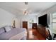 Well-lit main bedroom with wood floors at 2710 93Rd E Ct, Palmetto, FL 34221