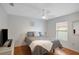 Bedroom featuring a full sized bed, ceiling fan, and window with natural light at 2710 93Rd E Ct, Palmetto, FL 34221