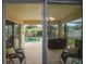 Covered patio with a view of the screened-in pool and backyard at 2710 93Rd E Ct, Palmetto, FL 34221