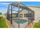 Well-maintained screened-in pool with lush landscaping, offering a private outdoor oasis for relaxation at 2710 93Rd E Ct, Palmetto, FL 34221