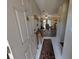 Inviting entryway flowing into a living area with ceiling fan and hardwood flooring at 3237 Pine Haven Dr, Clearwater, FL 33761