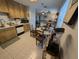 Kitchen featuring wood cabinets and tile floor that opens to the living room at 3237 Pine Haven Dr, Clearwater, FL 33761