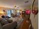 Comfortable living room with wood-look floors offering seamless flow into the kitchen and access to backyard at 3237 Pine Haven Dr, Clearwater, FL 33761