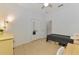 Well-lit bedroom with a simple bed, dresser, and ample storage, accentuated by clean lines and tile flooring at 3602 Secret Stroll Dr, Sarasota, FL 34240