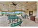 The community clubhouse offers a spacious seating area, perfect for gatherings and overlooking outdoor playground at 3602 Secret Stroll Dr, Sarasota, FL 34240