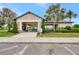 Exterior ground shot of the neighborhood clubhouse featuring a covered area with tables and green landscaping at 3602 Secret Stroll Dr, Sarasota, FL 34240
