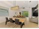 Bright dining room with a large table and chairs, perfect for Gathering gatherings and entertaining at 3602 Secret Stroll Dr, Sarasota, FL 34240