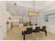 Open dining area with views into a modern kitchen that features stainless steel appliances at 3602 Secret Stroll Dr, Sarasota, FL 34240