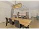 Dining area with a modern light fixture, stainless appliances and views of the kitchen at 3602 Secret Stroll Dr, Sarasota, FL 34240