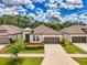 Charming single-Gathering home featuring a well-manicured lawn and a two-car garage at 3602 Secret Stroll Dr, Sarasota, FL 34240