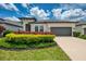 Charming single-Gathering home featuring a well-manicured lawn and a two-car garage at 3602 Secret Stroll Dr, Sarasota, FL 34240