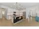 Modern kitchen with granite countertops, stainless steel appliances, and an island with bar seating at 3602 Secret Stroll Dr, Sarasota, FL 34240