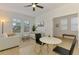 Open-concept living room featuring tile floors, neutral walls, and bright windows at 3602 Secret Stroll Dr, Sarasota, FL 34240