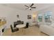 Living room with stylish decor, tile floors, bright lighting, and comfortable seating at 3602 Secret Stroll Dr, Sarasota, FL 34240