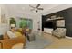 Cozy living room featuring a comfortable leather sofa, modern decor, and a relaxing atmosphere at 3602 Secret Stroll Dr, Sarasota, FL 34240