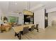 Open-concept living room and dining area, featuring stylish furniture and lots of natural light at 3602 Secret Stroll Dr, Sarasota, FL 34240