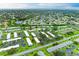 Aerial view showcasing the community layout and surrounding green spaces and water at 3905 34Th Avenue W Dr # 36, Bradenton, FL 34205