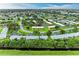 Wide aerial view of a well-planned residential community with lush greenery and serene landscaping at 3905 34Th Avenue W Dr # 36, Bradenton, FL 34205