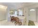 Formal dining room with a chandelier, large mirror, seating for six, and tiled flooring at 3905 34Th Avenue W Dr # 36, Bradenton, FL 34205