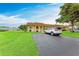 Residential home with well-kept lawn, paved driveway, and a parked white SUV at 3905 34Th Avenue W Dr # 36, Bradenton, FL 34205