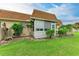 Charming home exterior with a screened-in lanai and manicured landscaping at 3905 34Th Avenue W Dr # 36, Bradenton, FL 34205