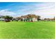 Well-maintained townhouse featuring a spacious lawn under a bright blue sky at 3905 34Th Avenue W Dr # 36, Bradenton, FL 34205