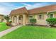 Inviting home exterior featuring a quaint covered entry and well-maintained lawn at 3905 34Th Avenue W Dr # 36, Bradenton, FL 34205