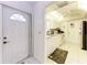 Bright kitchen with white cabinets, white appliances and tile floor, with entrance door at 3905 34Th Avenue W Dr # 36, Bradenton, FL 34205