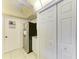 Bright kitchen with stainless steel refrigerator and ample white closet storage near tiled flooring at 3905 34Th Avenue W Dr # 36, Bradenton, FL 34205