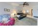 Spacious living area with carpet, ceiling fan, flows to the dining room, creating an open space at 3905 34Th Avenue W Dr # 36, Bradenton, FL 34205