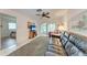 Cozy living room featuring a leather sofa, ceiling fan, and sliding doors at 3905 34Th Avenue W Dr # 36, Bradenton, FL 34205