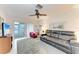 Inviting living area features carpet, ceiling fan and sliding door to the enclosed patio at 3905 34Th Avenue W Dr # 36, Bradenton, FL 34205