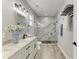 Modern bathroom with double sinks, a large walk-in shower, and stylish fixtures and lighting at 4314 Des Plaines Dr, Sarasota, FL 34233