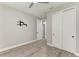 This neutral bedroom includes gray walls, wood-look floors, ceiling fan and closet at 4314 Des Plaines Dr, Sarasota, FL 34233