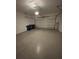 Spacious two-car garage with a sealed concrete floor and overhead lighting at 4314 Des Plaines Dr, Sarasota, FL 34233