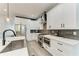 A kitchen with stainless steel appliances, white cabinets and a contrasting gray subway tile backsplash at 4314 Des Plaines Dr, Sarasota, FL 34233