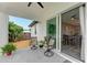 Covered patio with easy access from inside, featuring a dining table through sliding glass doors at 4314 Des Plaines Dr, Sarasota, FL 34233