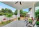 Relaxing covered patio featuring comfortable seating and a view of the private, fenced backyard at 4314 Des Plaines Dr, Sarasota, FL 34233