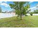 Spacious backyard featuring well-maintained lawn, privacy fence and large tree providing natural shade at 4649 72Nd E Ct, Bradenton, FL 34203