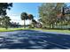 Community basketball court with a pool and tennis courts nearby and lush green landscaping in a park-like setting at 4649 72Nd E Ct, Bradenton, FL 34203