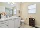 Bathroom features a single sink vanity, framed mirror, and a shower behind glass doors at 4649 72Nd E Ct, Bradenton, FL 34203