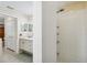 Bathroom featuring a walk-in shower, vanity, and neutral color scheme at 4649 72Nd E Ct, Bradenton, FL 34203